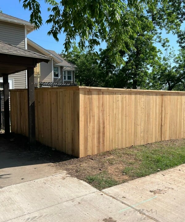 New wooden fence around a backyard